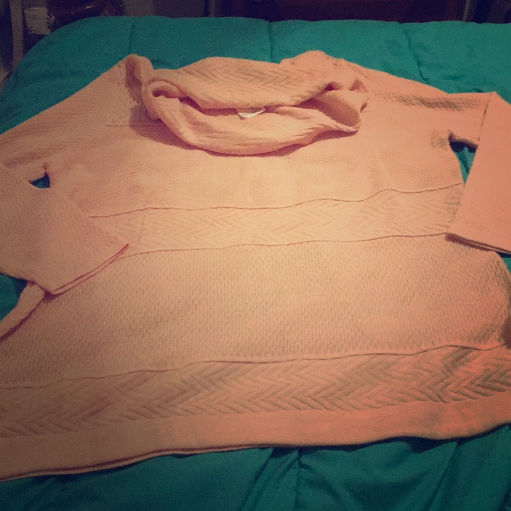 A peach sweater